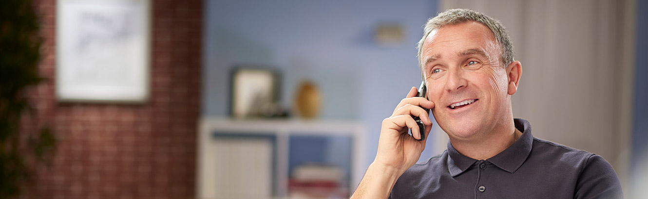 Man talking on phone in office