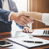 Close up of two people shaking hands